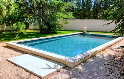a small swimming pool in a yard with at Charmant Mazet Provençal in Mazan