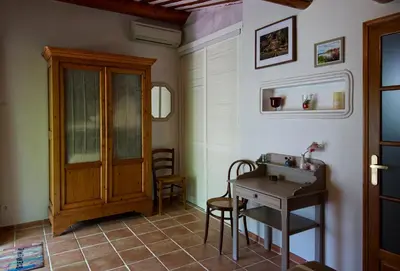a bathroom with a sink and a table at Catherine&Martial in Maubec