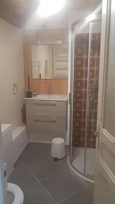a bathroom with a shower and a toilet and a sink at GitesLuberon 3 in Charleval
