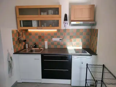 a kitchen with a sink and a counter top at GitesLuberon 4 in Charleval