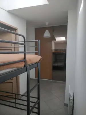 a room with two bunk beds and a hallway at GitesLuberon 4 in Charleval