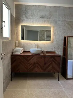 a bathroom with a sink and a mirror at 4 bedroom villa, private pool and garden in Cabrières-dʼAvignon