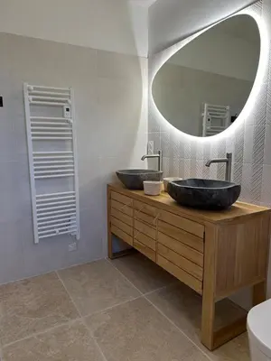 a bathroom with two sinks and a large mirror at 4 bedroom villa, private pool and garden in Cabrières-dʼAvignon