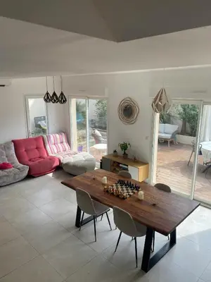 a living room with a table with chessetts on it at Peaceful Family Retreat In Aix-En-Provence in Puyricard