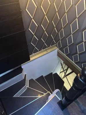 a view of a staircase with a tile wall at L'Or du Temps - Jacuzzi privé in Lançon-Provence