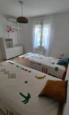 a bedroom with two beds and a room with two beds at 140 m2 villa with pool in Pernes-Les-Fontaines in Pernes-les-Fontaines