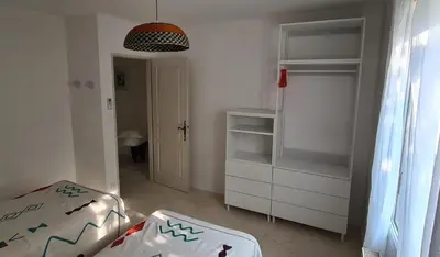 a small bedroom with a bed and white cabinets at 140 m2 villa with pool in Pernes-Les-Fontaines in Pernes-les-Fontaines