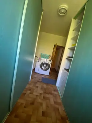 a hallway with a washing machine in a room at Les Mourguettes maison familiale avec piscine et garage sur 2000 m2 de terrain en campagne in Carpentras