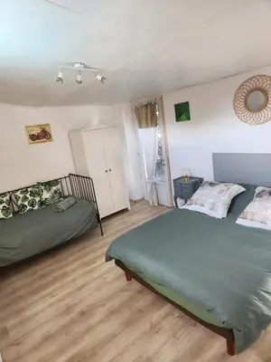 a bedroom with two beds in a room at MAISON Terrasse PISCINE in Cavaillon