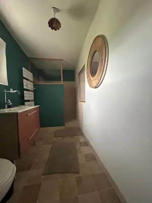 a bathroom with a toilet and a mirror on the wall at Silence et Reconnexion in Mormoiron