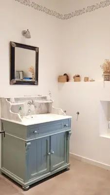a bathroom with a blue sink and a mirror at Provencal Farmhouse With Mont Ventoux Views in Carpentras