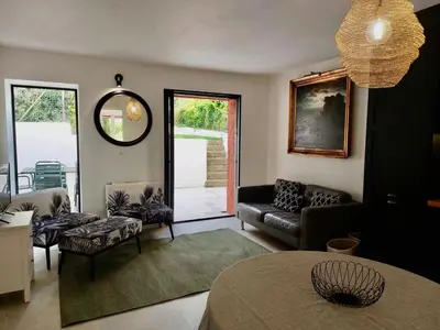 a living room with a couch and a table at La maison de Flassan chic et sport in Flassan