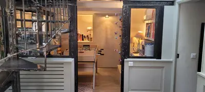 a room with a hallway with a mirror and a table at Maison de charme à Aix-en-Provence in Aix-en-Provence