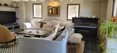 a living room with white furniture and a piano at Maison de charme à Aix-en-Provence in Aix-en-Provence