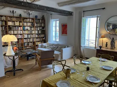 a living room with a couch and a table at Maison de village en Provence Luberon in Saint-Saturnin-les-Apt