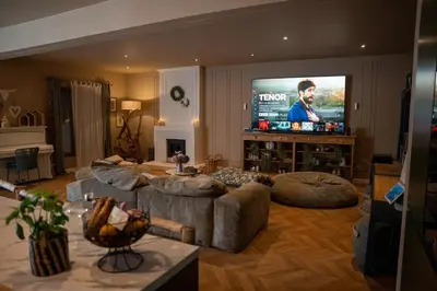 a living room with two couches and a tv at La Maison PP une Parenthèse Provençale in Carpentras