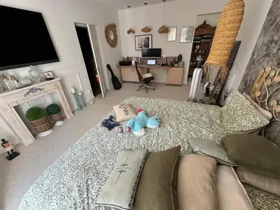 a living room with a couch and a tv at La Maison PP une Parenthèse Provençale in Carpentras