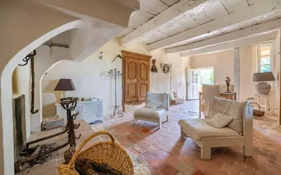 a living room with a couch and chairs in a room at Hameau de l'Esperelle in Simiane-la-Rotonde