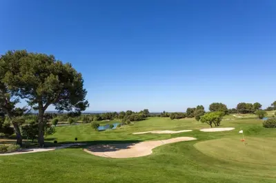 a view of a golf course with a green at Superbe appartement dans golf 4 étoiles in Saumane-de-Vaucluse
