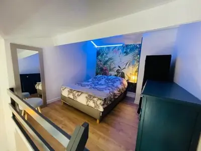 a bedroom with a bed and a desk in a room at City break in old center Aix! in Aix-en-Provence