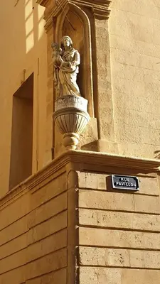 a statue of a woman on the side of a building at City break in old center Aix! in Aix-en-Provence