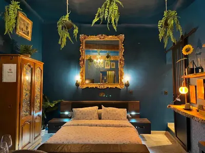 a bedroom with a bed and a mirror at Suite d'exception, luxe, élégance et raffinement in Aix-en-Provence