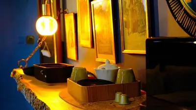 a table with cups and utensils on it at Suite d'exception, luxe, élégance et raffinement in Aix-en-Provence