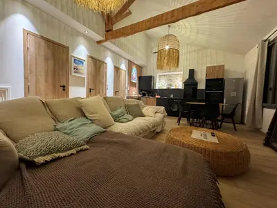 a living room with a couch and a table at La Maison PP - Appartements in Carpentras