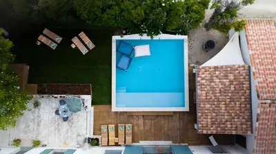 an overhead view of a swimming pool with a house at La Maison PP - Appartements in Carpentras