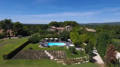 an aerial view of an estate with a swimming pool at La Cour Des Sens in Lagnes