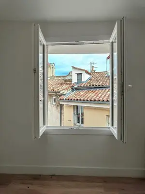 an open window with a view of buildings at New! Le zola studio lumineux en centre ville in Aix-en-Provence