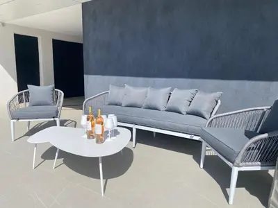 a living room with a couch and two chairs and a table at Villa Moderne 5 chambres - Aix-En-Provence - piscine in Le Tholonet