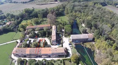 an aerial view of a building with a train on it at Maison dans un coin de verdure proche de la Sorgue in LʼIsle-sur-la-Sorgue