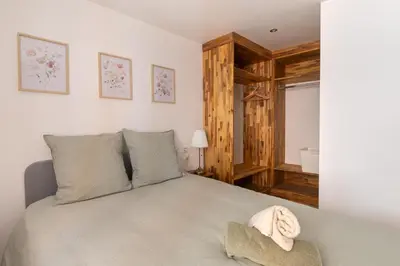 a bedroom with a bed with a towel on it at Le Duplex des Ocres - 2 bedrooms - Air conditioning - WiFi in Apt