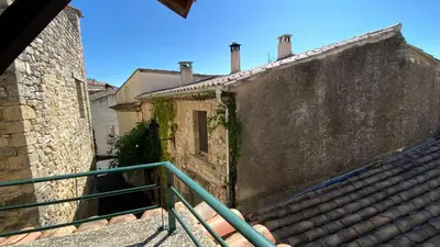 a bathroom with a sink and a tub and a toilet at La Mistraline, in the center of the Luberon, Provence 2 bedroom, 2 bath Village House in Caseneuve