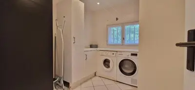 a white laundry room with a washer and dryer at Villa Rosa peaceful haven 10m from Aix 11 guests in Aix-en-Provence