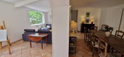 a living room with a blue couch and a table at Villa Rosa peaceful haven 10m from Aix 11 guests in Aix-en-Provence