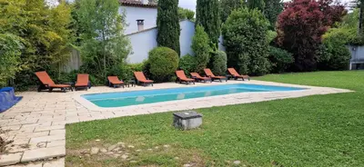 a group of chairs and a swimming pool at Villa Rosa peaceful haven 10m from Aix 11 guests in Aix-en-Provence