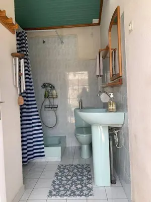 a bathroom with a sink and a toilet and a shower at Joli rez de villa proche d'Aix-en-Provence in Peyrolles-en-Provence