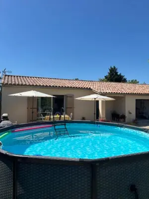 a large swimming pool with chairs and umbrellas at 