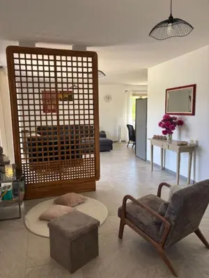 a living room with a couch and a chair at 