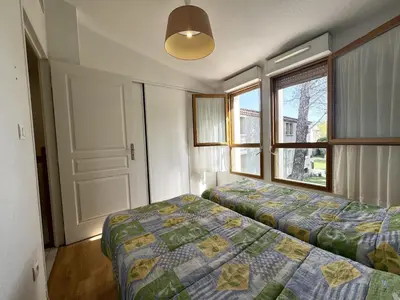 a bedroom with a bed and a window at résidence avec piscines à proximité de Gordes in Gordes