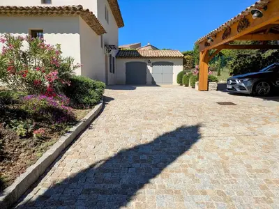 a shadow of a car parked next to a driveway at Villa haut de gamme avec piscine et grand jardin in Aix-en-Provence