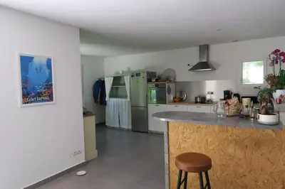 a kitchen with stainless steel appliances and a counter at L'embellie in Châteaurenard