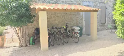 a group of bikes parked under a shed at Mas Cabannes en Provence in Cabannes