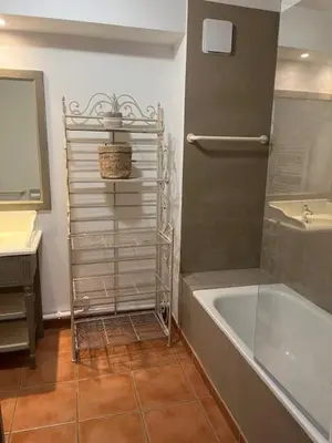 a bathroom with a shower and a tub and a sink at Appartement de charme sur le domaine de Pont Royal à Mallemort, en rez-de-jardin avec terrasse & piscine et vue sur le Golf in Mallemort