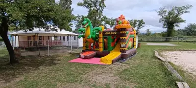 a playground with an inflatable bounce house in a park at Mobile Home en Provence in La Roque-dʼAnthéron
