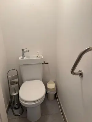 a bathroom with a white toilet and a sink at Aix en Provence, dans grande résidence arborée, appartement de 80m2 in Aix-en-Provence