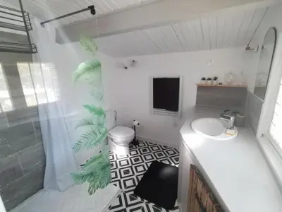 a small bathroom with a toilet and a sink at La Ch'tite Maison in Céreste