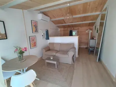 a living room with a couch and a table at La Ch'tite Maison in Céreste